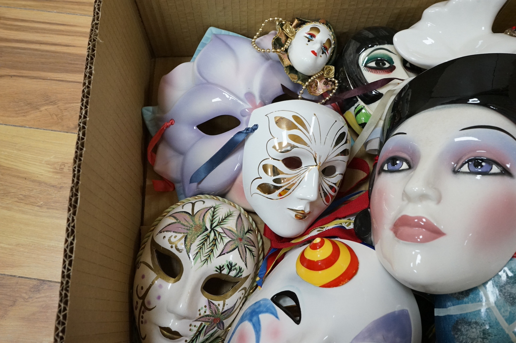 A large collection of various painted wall masks. Condition - varies
